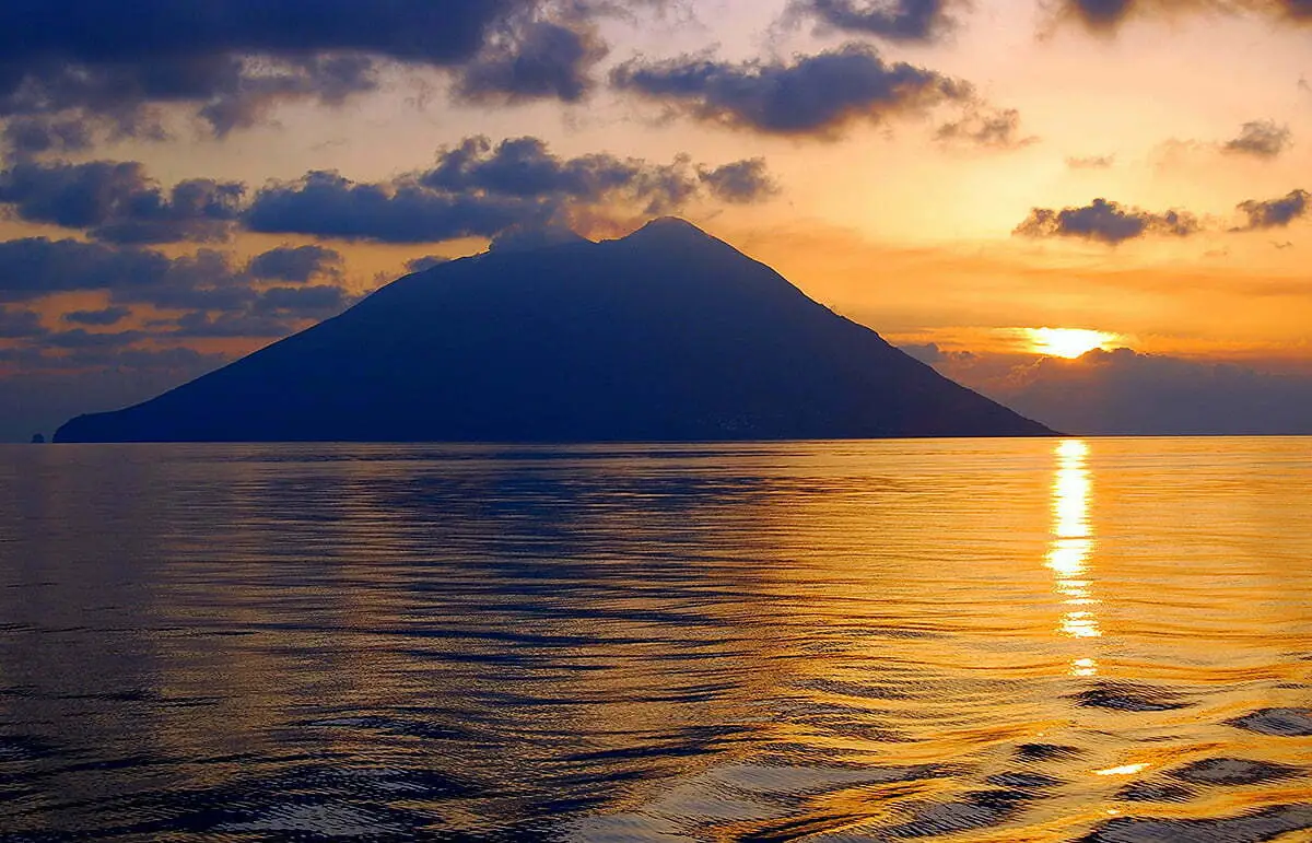 Stromboli volcano at sunset viewed from the sea in the Aeolian Islands