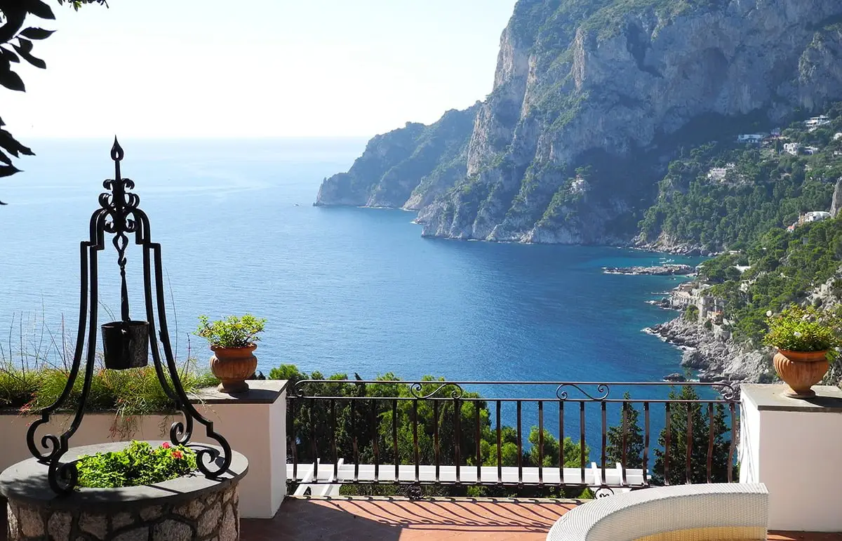 Scenic Amalfi Coast view from a private terrace with iron railing