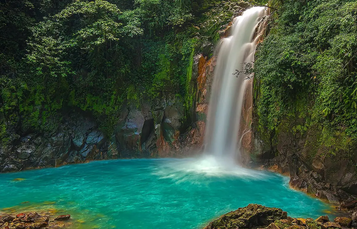 Rio Celeste waterfall in Costa Rica, a spectacular inland excursion accessible during a luxury yacht charter