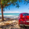 Classic car on a beach in Cuba - Echonautique.com Cuba