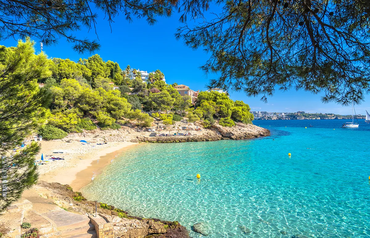 Mallorca yacht charter Cala Contesa beach turquoise water Balearic Islands Spain