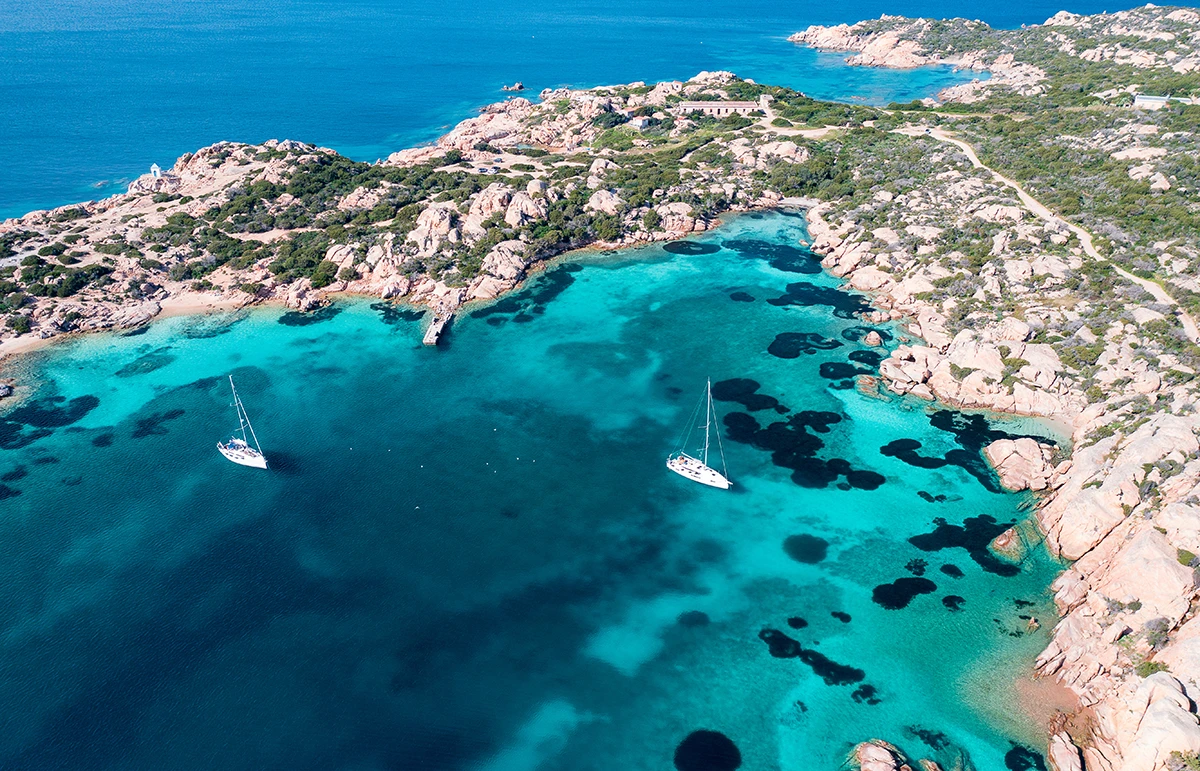 Cala Francese La Maddalena Sardinia turquoise water yacht anchorage aerial view
