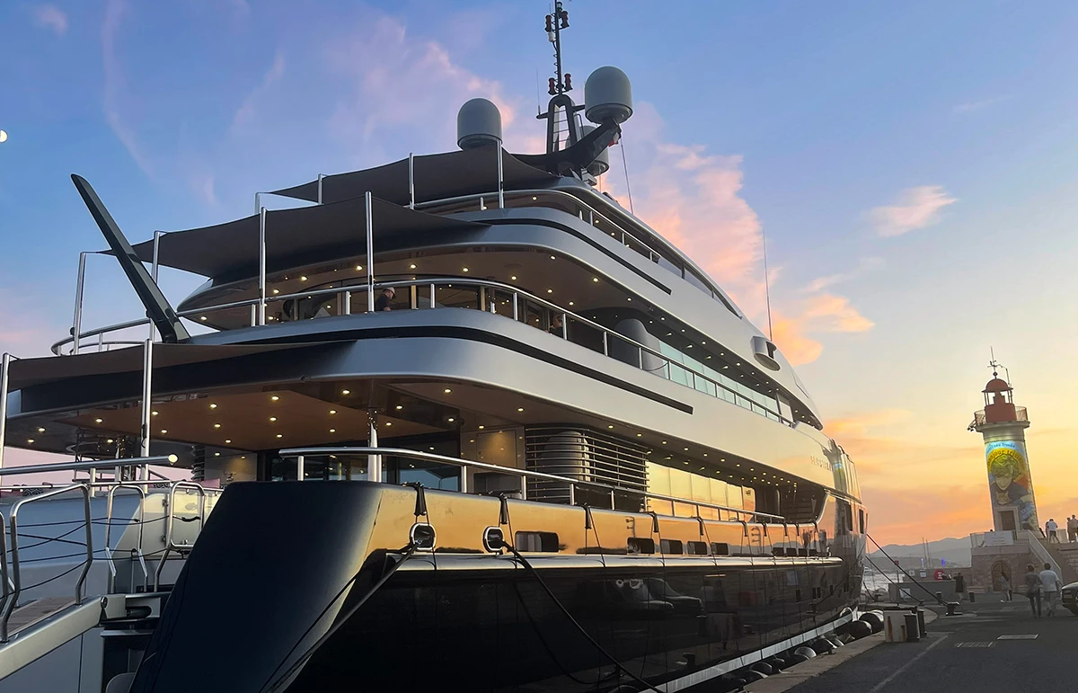 Superyacht on the quay of the Mole Jean-Réveille in St Tropez harbour at sunset